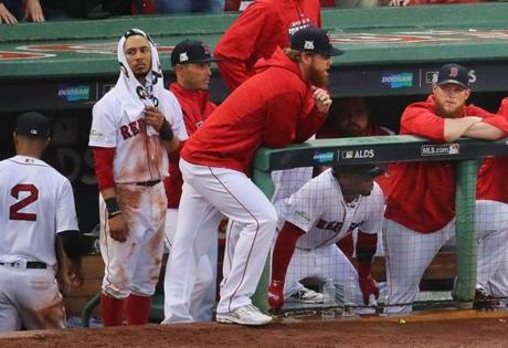Boston-10/09/17-Red Sox vs Astros Game 4 ALDS. Sox Mookie Bwtts has a towel on his head a he stands with teammates in the 9th inning with two outs. John Tlumacki/Globe staff(sports)
