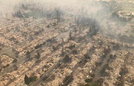 WILDFIRES SLIDER HANDOUT EDITORIAL USE ONLY/NO SALES Mandatory Credit: Photo by CALIFORNIA HIGHWAY PATROL/HANDOUT/EPA-EFE/REX/Shutterstock (9125871d) A California Highway Patrol handout aerial image of a destroyed neighborhood in Santa Rosa, California, USA, 09 October 2017 (issued 10 October 2017). Multiple wildfires are scattered through out Napa, Sonoma and Mendocino counties, leaving at least 10 people dead and destroying homes and businesses in their path. Wildfires burn Northern California, leaving at least 10 people dead, Santa Rosa, USA - 09 Oct 2017
