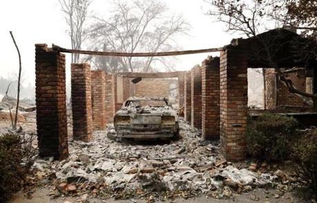 WILDFIRES SLIDER Mandatory Credit: Photo by JOHN G. MABANGLO/EPA-EFE/REX/Shutterstock (9125107ae) A destroyed car sits in the remains of a home in Santa Rosa, California, USA, 09 October 2017. Multiple wildfires are scattered through out Napa, Sonoma and Mendocino counties, leaving at least 10 people dead and destroying homes and businesses in their path. Wildfires burn Northern California, leaving at least 10 people dead, Santa Rosa, USA - 09 Oct 2017
