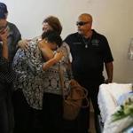 Ana Ruiz was consoled as funeral directors prepared to close the casket of her husband, Victor Hugo Ruiz, in Corozal, Puerto Rico.