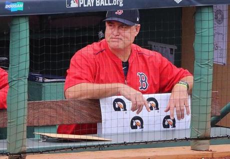 Boston-10/08/17-Red Sox vs Astros Game 3 Division Series- Sox manager John Farrell looks out from the dugout before the start of the game. John Tlumacki/Globe Staff(sports)
