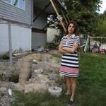 Marjan Sadegh, next to the remains of her backyard deck.