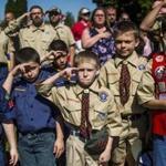 Boy Scouts and Cub Scouts saluted during a Memorial Day ceremony in Linden, Mich. 