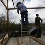 Men worked repairing a partially destroyed bar three weeks after Hurricane Maria hit Puerto Rico.