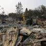 Cal Fire forester Kim Sone inspected damage at homes destroyed by wildfires in Santa Rosa, Calif., on Thursday.
