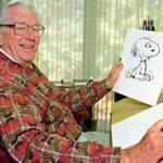Cartoonist Charles Schulz displays a sketch of his beloved character 