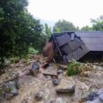 Flash floods damage a house in northern province of Hoa Binh, Vietnam on Friday.