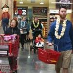 Opening-day customers at the Trader?s Joes in Allston got leis to wear;