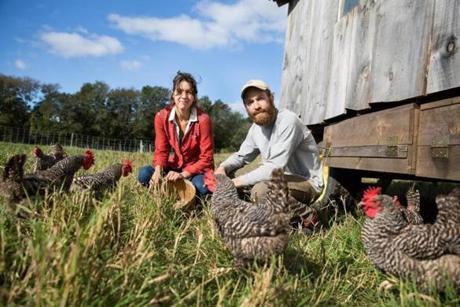 Raynham, MA -- 10/12/17 -- Farmers Marie Kaziunas (left), and Chuck Currie, pose for a portrait with their chickens, at Freedom Food Farm, on October 12, 2017, in Raychem, Massachusetts. (Kayana Szymczak for The Boston Globe)
