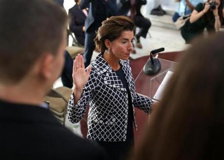 Rhode Island Governor Gina M. Raimondo giving the oath of office last week at a swearing in ceremony for Melissa A. Long (not pictured) as an associate justice of the Rhode Island Superior Court.
