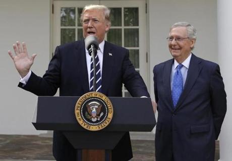 President Donald Trump answers questions with Senate Majority Leader Mitch McConnell, R-Ky., in the Rose Garden after their meeting at the White House, Monday, Oct. 16, 2017, in Washington. (AP Photo/Evan Vucci)
