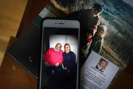 A cellphone photo shows Brigitte Darton as she sits with her father, William Nutter, on a visit, not long before he died. He was a Vietnam combat veteran who died at the Bedford VA hospital when a nurse failed to check in on him. 
