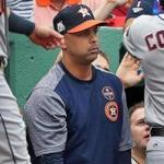 Boston, MA: October 9, 2017: Former Red Sox infielder Alex Cora (pictured) has been mentioned as a possible replacement for fired Boston manager John Farrell (not pictured). Cora, shown in the visitor's dugout at Fenway Park, is currently the bench coach for the Houston Astros. The Boston Red Sox hosted the Houston Astros in Game Four of an ALDS baseball game at Fenway Park. (Jim Davis/Globe Staff).