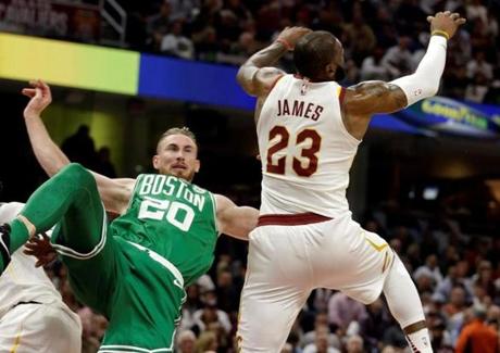 Gordon Hayward (20) falls after colliding with LeBron James (in the first quarter Tuesday. Hayward broke his left ankle on the play.
