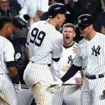 NEW YORK, NY - OCTOBER 17: Aaron Judge #99 of the New York Yankees celebrates after scoring on a Gary Sanchez #24 double with Todd Frazier #29 and Greg Bird #33 during the eighth inning against the Houston Astros in Game Four of the American League Championship Series at Yankee Stadium on October 17, 2017 in the Bronx borough of New York City. (Photo by Al Bello/Getty Images)