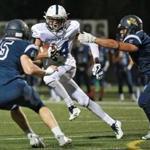 Lynnfield Ma 10/20/17 Hamilton-Wenham High Cam Peach looking for room to run in between Lynnfield High Nathan Drislane (45) and Anthony Murphy during first half action of MIAA football at Lynnfield High. (Matthew J. Lee/Globe staff) topic 21schlynnfield reporter Karl Capen