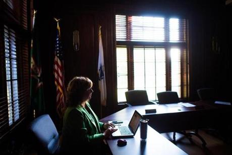 Dottie Fulginiti, vice chair of the Easton Board of Selectmen, prepares for a meeting at Town Hall in Easton, Monday, Sept. 11, 2017. Gretchen Ertl for The Boston Globe.
