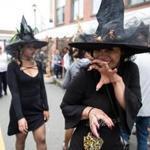 Salem, MA -- 10/08/17 -- Brittany Rose, a visitor from Orlando, walks around the street dressed as a witch during Salem Haunted Happenings, on October 8, 2017, in Salem, Massachusetts. (Kayana Szymczak for The Boston Globe)
