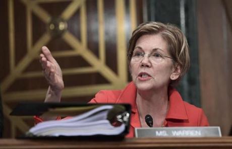 Sen. Elizabeth Warren, D-Mass., questions Wells Fargo Chief Executive Officer and President Timothy Sloan as he testifies before the Senate Committee on Banking, Housing and Urban Affairs on Capitol Hill in Washington, Tuesday, Oct. 3, 2017. (AP Photo/Susan Walsh)
