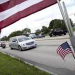 A hearse carrying the body of the US Army Sergeant La David Johnson drove away after Saturday?s funeral service in Cooper City, Fla.