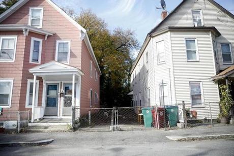 The fenced-in area where a 7-year-old boy was killed by two pit bulls is seen in Lowell.
