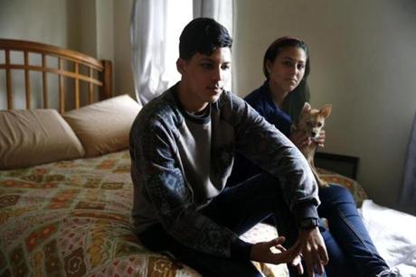 Erick Torres and sister Jerielis posed for a photo at their grandmother?s Jamaica Plain apartment. Their home in Puerto Rico was ruined.
