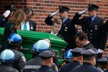 Family members carried the casket of 6-year-old Devin Suau on Tuesday.
