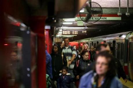 10/25/2017 Boston Ma - Commuters disembark from a Red Line Train at Downtown Crossing, as the countdown clock shows the time of next train to arrive at Downtown Crossing. (Jonathan Wiggs\Globe Staff) Reporter:Topic. 
