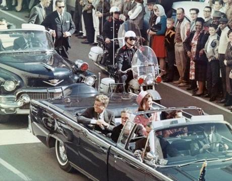 President John F. Kennedy and his wife, Jacqueline, smiled at the crowds lining their motorcade route in Dallas, Texas, on Nov. 22, 1963. The president was assassinated minutes later.
