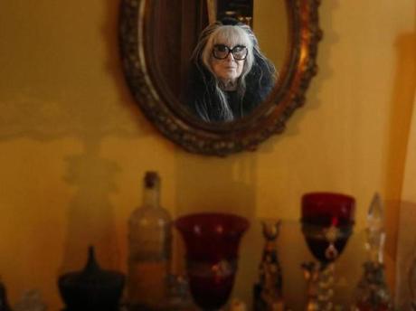 Laurie Cabot reflected in a mirror inside her home in Salem.
