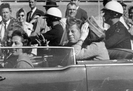 President John F. Kennedy (center).
