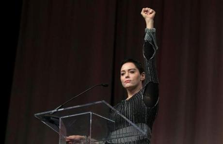 Actress Rose McGowan raises her fist Friday at the Women?s Convention in Detroit.
