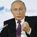 Russian President Vladimir Putin gestures while answering questions at a press conference in Sochi, Russia.