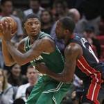Boston Celtics guard Marcus Smart (36) looks for an open teammate past Miami Heat guard Dion Waiters (11) during the first half of an NBA basketball game, Saturday, Oct. 28, 2017, in Miami. (AP Photo/Wilfredo Lee)