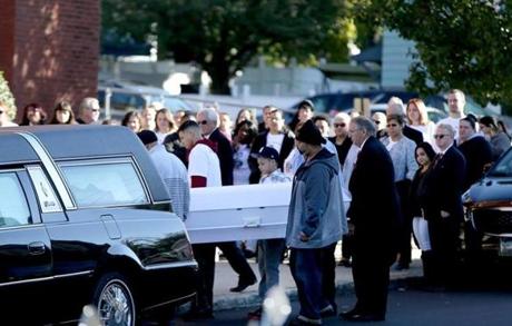 Pallbearers carried the casket to the funeral Mass for Javian Candolario at St. Michael Church in Lowell.
