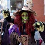 Brian Sims of the Salem Black Hat Society performed for the crowd at the annual Salem Halloween celebration. 