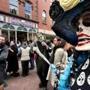 Salem, MA: 10-15-2016: Visitors to Haunted Happenings pass a paper mache Catrina at a vendor's stand on the Essex St. Pedestrian Mall in Salem, Mass. Oct. 15, 2016. The month long Haunted Happenings lead up to Halloween. Photo/John Blanding, Boston Globe staff story/, Metro ( feature )