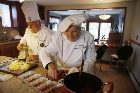 Denise Graffeo, making eggplant Parmesan with her husband, Tony, at their Saugus home, earned Hall of Fame honors.
