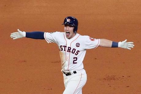 Alex Bregman, the hero of the game, celebrated after driving in the winning run.

