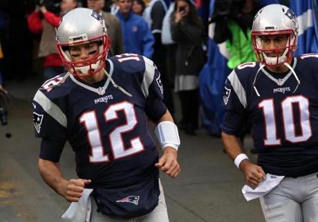 Orchard Park, NY - 10/30/2016 - New England Patriots quarterback Tom Brady (12) and New England Patriots quarterback Jimmy Garoppolo (10) take to the field for pre game warm ups. The Buffalo Bills host the New England Patriots at New Era Field in Orchard Park, NY. - (Barry Chin/Globe Staff), Section: Sports, Reporter: Ben Volin, Topic: 31Patriots-Bills, LOID: 8.3.470379750.
