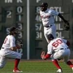 Boston, MA - 8/20/2017 - (9th inning) Boston Red Sox left fielder Andrew Benintendi, Boston Red Sox right fielder Mookie Betts, and Boston Red Sox center fielder Jackie Bradley Jr. celebrate the 5-1 win with their Outfielders' dance. The Boston Red Sox host the New York Yankees in the third of a three game series at Fenway Park. - (Barry Chin/Globe Staff), Section: Sports, Reporter: Peter Abraham, Topic: 21Red Sox-Yankees, LOID: 8.3.3472797547.
