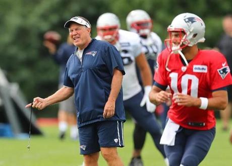 Foxborough-8/05/17- The Patriots held their trainiing camp Saturday at Gillette Stadium practice fields. Coach Bill Belichick smiles as he chats during warmups with qb Jimmy Garoppolo(rt). John Tlumacki/Globe Staff(sports)

