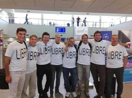 From left to right: Hernan Ferrucci, Alejandro Pagnucco, Ariel Erlij, Ivan Brajkovic, Juan Trevisan, Hernan Mendoza, Diego Angelini, and Ariel Benvenuto at Islas Malvinas international airport in Rosario, Argentina, gathered moments before traveling to New York. The friends were celebrating the 30th anniversary of their high school graduation with a trip to New York City.
