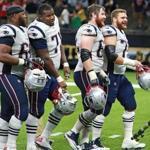 New Orleans, LA: September 17, 2017: Patriots offensive linemen, left to right, Shaq Mason, Cameron Fleming, Joe Thuney and Ted Karras are all smiles as they leave the field following New England's victory. The New England Patriots visited the New Orleans Saints in a regular season NFL football game at the Mercedes-Benz Superdome. (Jim Davis/Globe Staff). 