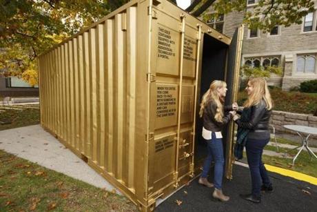 11/5/2017 - Cambridge, MA - Harvard Divinity School - Shannon Boley, cq, left; and Dorie Goehring, cq, right, are curators of the Portal installation at the Harvard Divinity School. A specially equipped shipping container at Harvard University called ÒThe PortalÓ by creator Amor Bakshi, cq, of Brooklyn, NY, contains technology that enables real-time conversations between small groups of people across the globe. The intention is to allow refugees in cities such as Berlin, Germany; Amman, Jordan; Gaza City, Palestine and Erbil, Iraq to speak directly with people in the US in such a way that the two parties feel that they inhabit the same space. The installation is currently behind the Harvard Divinity School, and travels soon to Boston College, and then continues on its tour. Topic: 06portal(2). Story by Jeremy Fox and Cristela Guerrera/Globe Staff. Photo by Dina Rudick/Globe Staff
