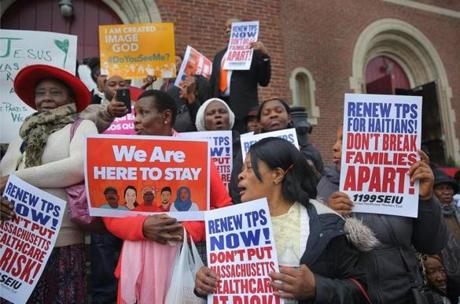 Boston, MA - 11/5/2017 - A rally by Haitians and their supporters is held in front of St. Angela Catholic Church (cq), in Mattapan. Participants urge the preservation of TPS (temporary protective status) for Haitians and those from the Latin-American immigrant communities. Photo by Pat Greenhouse/Globe Staff Topic: 06haitianrally Reporter: XXX
