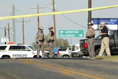 Law enforcement officials gathered Sunday at the shooting scene.
