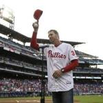 FILE - In this Aug. 8, 2014, file photo, former Philadelphia Phillies' Roy Halladay acknowledges the crowd before a baseball game against the New York Mets, in Philadelphia. Authorities have confirmed that former Major League Baseball pitcher Roy Halladay died in a small plane crash in the Gulf of Mexico off the coast of Florida, Tuesday, Nov. 7, 2017. (AP Photo/Matt Slocum, File)