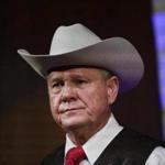 FILE - In this Monday, Sept. 25, 2017, file photo, former Alabama Chief Justice and U.S. Senate candidate Roy Moore speaks at a rally, in Fairhope, Ala. According to a Washington Post story Nov. 9, an Alabama woman said Moore made inappropriate advances and had sexual contact with her when she was 14. (AP Photo/Brynn Anderson, File)