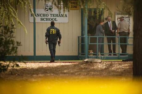 FBI agents are seen behind yellow crime scene tape outside Rancho Tehama Elementary School after a shooting in the morning on November 14, 2017, in Rancho Tehama, California Four people were killed and nearly a dozen were wounded, including several children, when a gunman went on a rampage at multiple locations, including a school in rural northern California. / AFP PHOTO / Elijah NouvelageELIJAH NOUVELAGE/AFP/Getty Images
